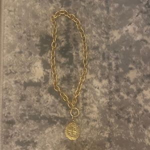 Gold necklace with toggle closure